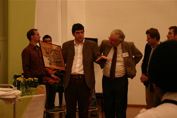 36. Jacques Cheminade looks at framed artwork